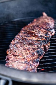 grilled flat steak on the grill with text overlay