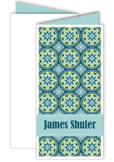 a folded card with the name james shuler in blue and green circles on it