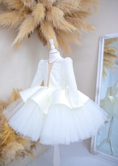 Ivory, Flower Girl Gown, Birthday Girl Dress, Baby Dress, Sparkling Dress, Graduation, Wedding Kids Gown, Long Sleeve, Knee Dress, Special Occasion, Toddler Outfit Fuchsia Girl Dress, Birthday Dress, Baby Girl Dress, Tutu, Peplum Dress, Graduation Gown, Wedding Baby Gown, Long Sleeve, Glitter Dress, Toddler Knee Dress, Special Occasion, Kids Outfit Luxury baby girl dress have very original fashionable design will be perfect for any celebration....birthday, wedding, parties, Christmas, photography, Valentine's Day, dance, evening, flower girl  dress, ball gown, festivals wear, dance, dress-up, fairy & princess costumes or other special occasional events.    All our dresses are made with great love and care. We stand behind our work. Highest quality and 100% satisfaction guaranteed service. Cream Fitted Princess Dress For Wedding, White Tulle Ball Gown Tutu Dress, White Ball Gown Tutu Dress For First Communion, Cream Princess Gown Fitted, Cream Tulle Gown For Party, Long Sleeve Princess Dress With Ruffles For Wedding, White Princess Tulle Gown, Cream Fitted Princess Ball Gown, Long Sleeve Wedding Princess Dress With Ruffles