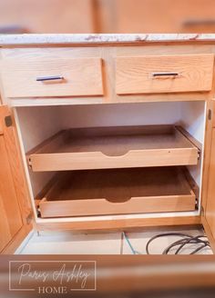 an unfinished kitchen cabinet with drawers in it