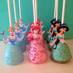 there are some candles that have princesses on them in the shape of mermaids