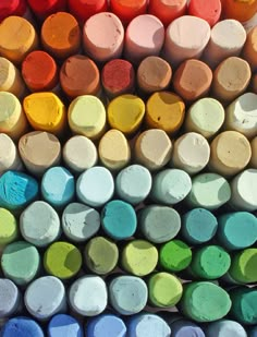 many different colored crayons are arranged together