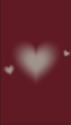 a blurry image of a heart in the middle of a dark red background with white hearts