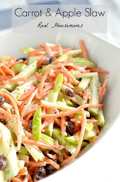 carrot and apple slaw with raisins in a white bowl