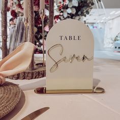 a table setting with place cards and utensils for guests to use on their wedding day