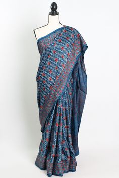 Add a touch of timeless elegance to your wardrobe with our Hand Printed Ajrakh Saree on Modal Silk in Blue. This stunning saree features intricate traditional Ajrakh printing and is crafted from luxurious modal silk fabric, making it a statement piece for any special occasion. The beautiful blue hue adds a pop of color to your ensemble, while the soft and smooth texture of the modal silk ensures utmost comfort. Each saree is meticulously hand printed by skilled artisans, making it a truly unique Blue Chanderi Pre-draped Saree With Motifs, Blue Kalamkari Pre-draped Saree For Diwali, Traditional Block Print Cotton Silk Pre-draped Saree, Indigo Chanderi Traditional Wear For Diwali, Indigo Traditional Drape For Navratri, Diwali Indigo Chanderi Traditional Wear, Transitional Blue Cotton Silk Pre-draped Saree, Blue Cotton Silk Traditional Wear With Kalamkari Print, Indigo Traditional Wear For Festivals