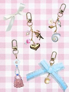 four different types of key chains on a pink and white checkered tablecloth