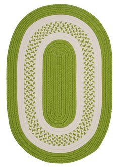 a green and white rug with an oval design