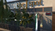 an outside view of a building with a sign that says the i spot