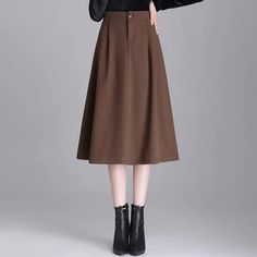 • High Waist Design :The high waist design of this brown wool skirt accentuates the waistline, creating a flattering silhouette for any body type. • Loose A-line Cut :The loose A-line cut offers a comfortable fit while adding a touch of elegance to your outfit. Perfect for commuting or casual outings. • 2023 Autumn and Winter Collection :Part of our 2023 Autumn and Winter collection, this skirt is designed to keep you warm and stylish in the colder months. • Mainland China Origin :Originating from Mainland China, this skirt reflects the countrys rich textile heritage, ensuring high-quality craftsmanship. • Elegant Commuting Hip :This skirts elegant commuting hip style makes it a versatile addition to any wardrobe, suitable for both work and leisure activities. • Small Size :Its small size Winter A-line Solid Color Bottoms, Winter A-line Bottoms In Solid Color, Brown Skirt For Fall, Winter Solid Brown Bottoms, Brown Solid Color Winter Bottoms, Brown Lined Skirt For Fall, Fall High Waist Solid Skirt, Solid High Waist Skirt For Fall, Fitted Brown Skirt Solid Color