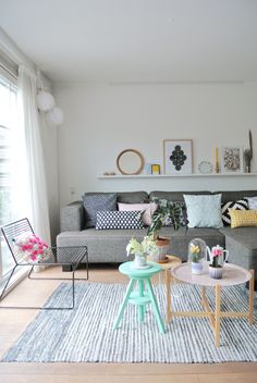 a living room filled with furniture and decor