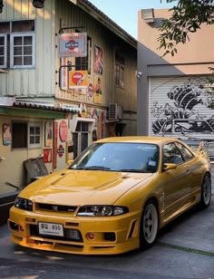 a yellow car parked in front of a building