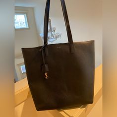 Authentic Black Leather Ysl Shopping Tote. Great Condition Overall But Has Some Minor Wear On Strap, Inside And Around Bag. Bag Is Really Durable And Well Made, It’s Also Black So It Hides Imperfections Pretty Well. Ysl Hardware That Hangs On The Bag Strap Comes With The Bag, Serial Shown In Photos. Ysl Shopping Tote, Bags Ysl, Saint Laurent Bags, Yves Saint Laurent Bags, Bag Bag, Shopping Tote, Bag Straps, Womens Tote Bags, Made It