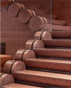 the stairs are made of red granite