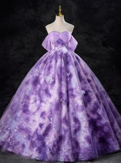 Embody the essence of the stars with this breathtaking purple prom dress that is nothing short of extraordinary! The cosmic-themed fabric, with its galaxy-like swirls and delicate shimmer, sets this gown apart as a true statement piece. The sweetheart neckline paired with soft, off-the-shoulder tulle creates a flattering and romantic look, while butterfly appliques sprinkled across the skirt add a whimsical touch. This dress effortlessly combines elegance with fantasy, making it perfect for any magical evening.  The fitted bodice ensures a secure and flattering fit, while the layers of tulle in the full skirt create a dramatic and ethereal effect. Perfect for prom, quinceaneras, or any event where you want to leave a lasting impression, this gown is designed for those who aren't afraid to Wedding Dress Purple, Purple Ball Gown, Purple Prom Dress, Sequin Appliques, Quinceanera Dress, Purple Ombre, Wedding Dresses Plus Size, Prom Dresses Ball Gown, Dress Purple