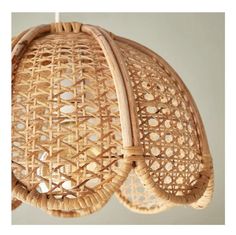 two wicker lamps hanging from the ceiling