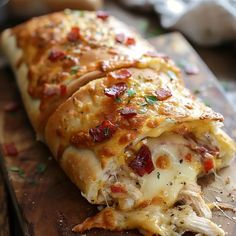 a cheesy pizza on a wooden cutting board