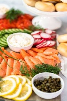 an assortment of vegetables and dips on a platter