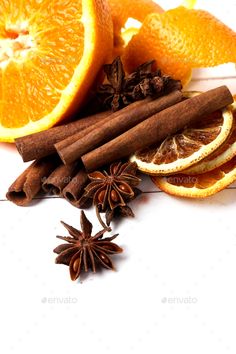 an assortment of oranges and spices on a white background - stock photo - images