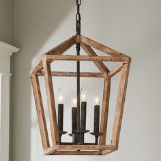 a wooden lantern hanging from the ceiling