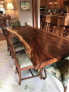 a large wooden table sitting in the middle of a living room