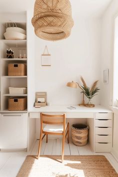 a white room with wicker baskets hanging from the ceiling and a chair in front of it