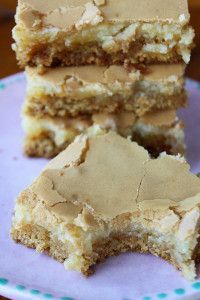 three pieces of cake sitting on top of a blue and white plate next to each other