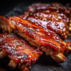 ribs covered in bbq sauce and garnished with parsley