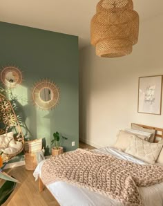 a bedroom with green walls and white bedding, wicker hanging from the ceiling