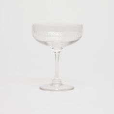 an empty wine glass on a white background