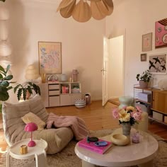 a living room filled with furniture and flowers