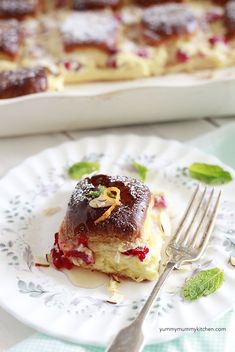 a piece of cake sitting on top of a plate next to a knife and fork