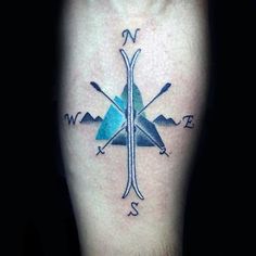 a compass tattoo on the leg