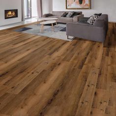 a living room with hardwood floors and furniture