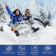 two people sitting on an inflatable snow sled