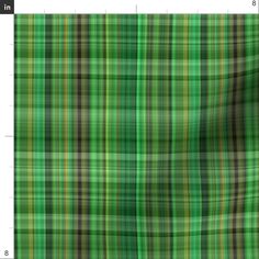 an image of a green plaid pattern with black and yellow stripes on it, as well as the size of the fabric