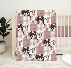 a baby crib with a pink and white checkered blanket