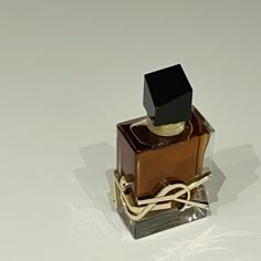 a bottle of perfume sitting on top of a table