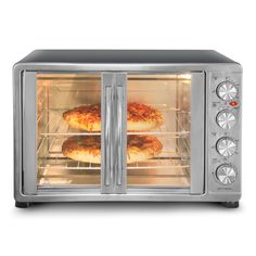 two pizzas are being cooked in an open toaster oven on a white background