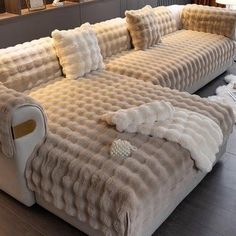 a very large couch with some pillows on it