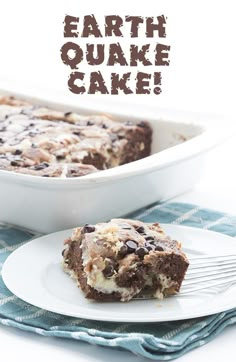 a close up of a piece of cake on a plate with a fork near by