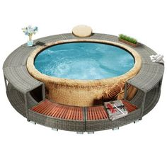 an inflatable hot tub is surrounded by wood and brick flooring, as well as flowers