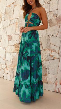 Make a statement with this bold green halter maxi dress. Featuring a stunning center-front cut-out, a tiered skirt, and an elegant halter neck, this dress is designed to turn heads. Tropical Dress, Wedding Attire Guest, Halter Maxi, Halter Maxi Dresses, Tiered Skirt, Invisible Zipper, Dress Codes, Guest Dresses, Cut Outs