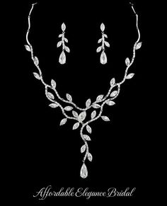 Stunning CZ Vine Bridal Jewelry Set You'll love the dazzling sparkle of our glamorous new cz bridal jewelry set. Add glamour to your wedding day look with this elegant necklace and earrings jewelry set. This silver or gold plated jewelry set will be a memorable addition to your wedding ensemble. It features AAA quality teardrop and marquise cz crystals in a dramatic vine design. The beautiful matching drop earrings are for pierced ears. Size: Necklace - about 16.5" Long. Pierced Earrings are about 1.5" long. Color: Silver or Gold. Style: nemr4225. Please allow 1 week for delivery. Shipping Policy . Return Policy. Wedding Jewelry Ideas, Wedding Accessories For Bride, Silver Bridal Earrings, Formal Jewelry, Bridal Jewelry Set, Dress Indian, Vine Design, Punk Jewelry, Pretty Jewelry