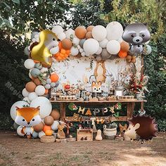 an animal themed birthday party with balloons and decorations