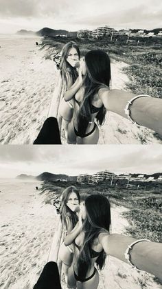 two women are posing on the beach with their arms around each other's shoulders