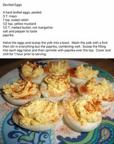 deviled eggs with mayonnaise spread on a blue and white plate, labeled deviled eggs