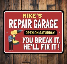 a red sign that says, mike's repair garage open on saturday you break it, he'll fix it