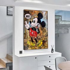 a mickey mouse painting hanging on the wall