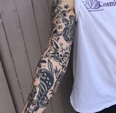 a man with a tattoo on his arm